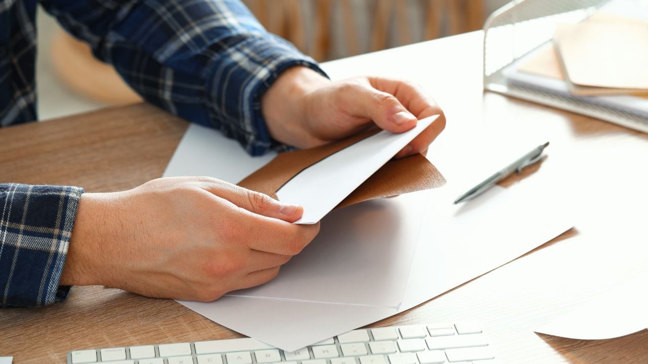 Man opening envelope