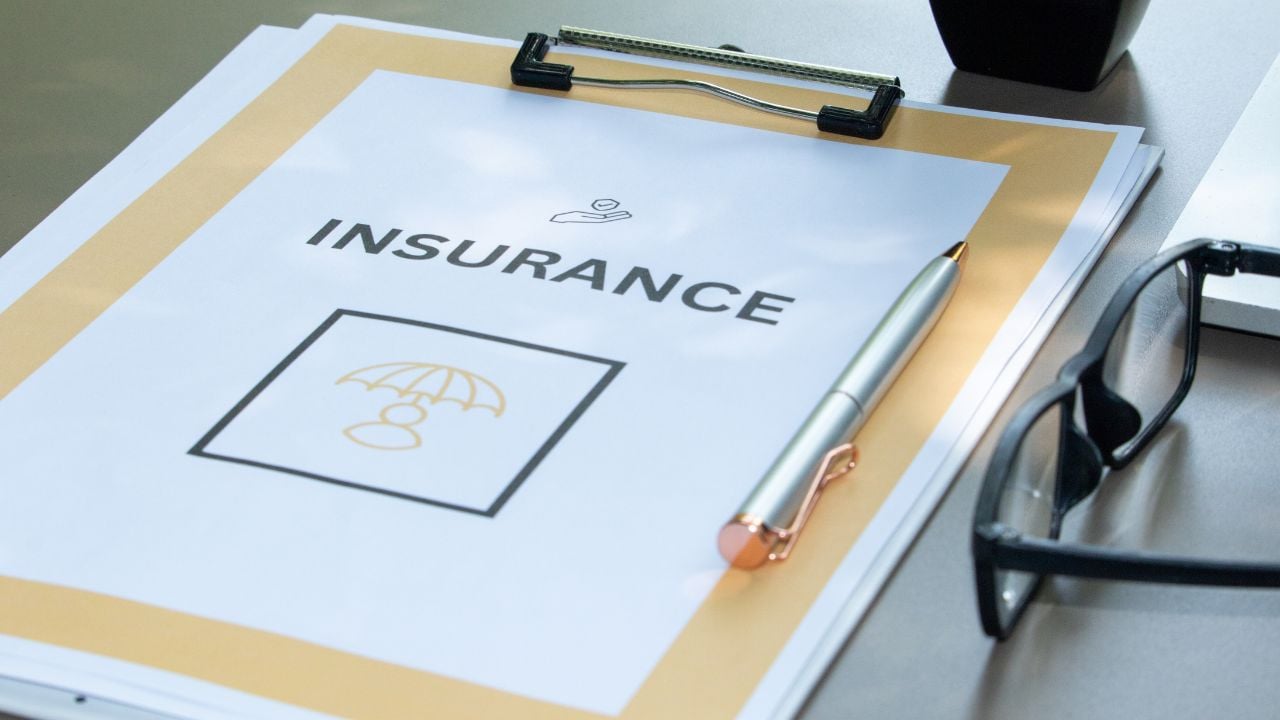 insurance tasks with a paper clipboard
