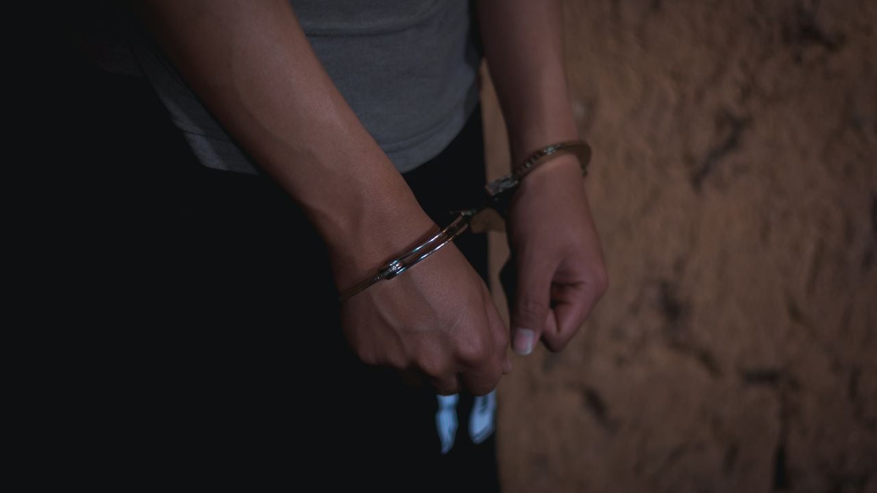 Boy hand with handcuff, arrested