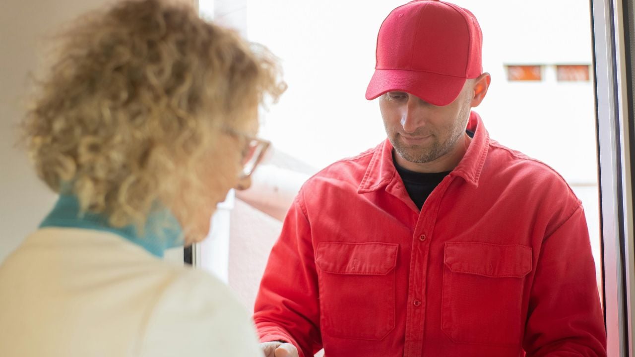 Older woman, old woman with courier, delivery guy