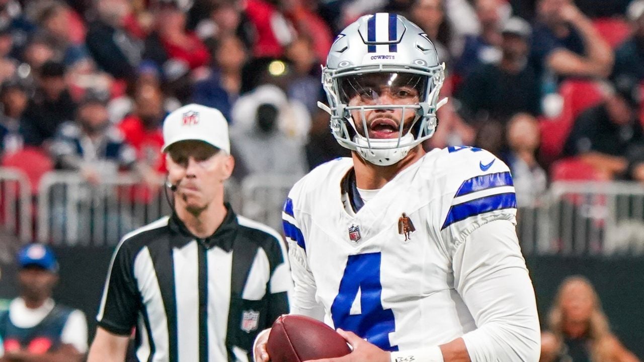 ATLANTA, GA-NOV 3: Dallas Cowboys quarterback Dak Prescott (4) looks to throw the ball against the Atlanta Falcons on November 3, 2024 at Mercedes-Benz Stadium.