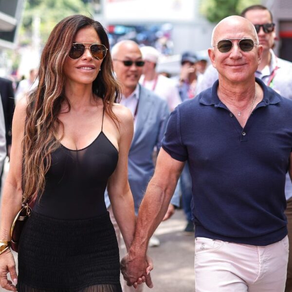 Jeff Bezos walks with Lauren Sanchez