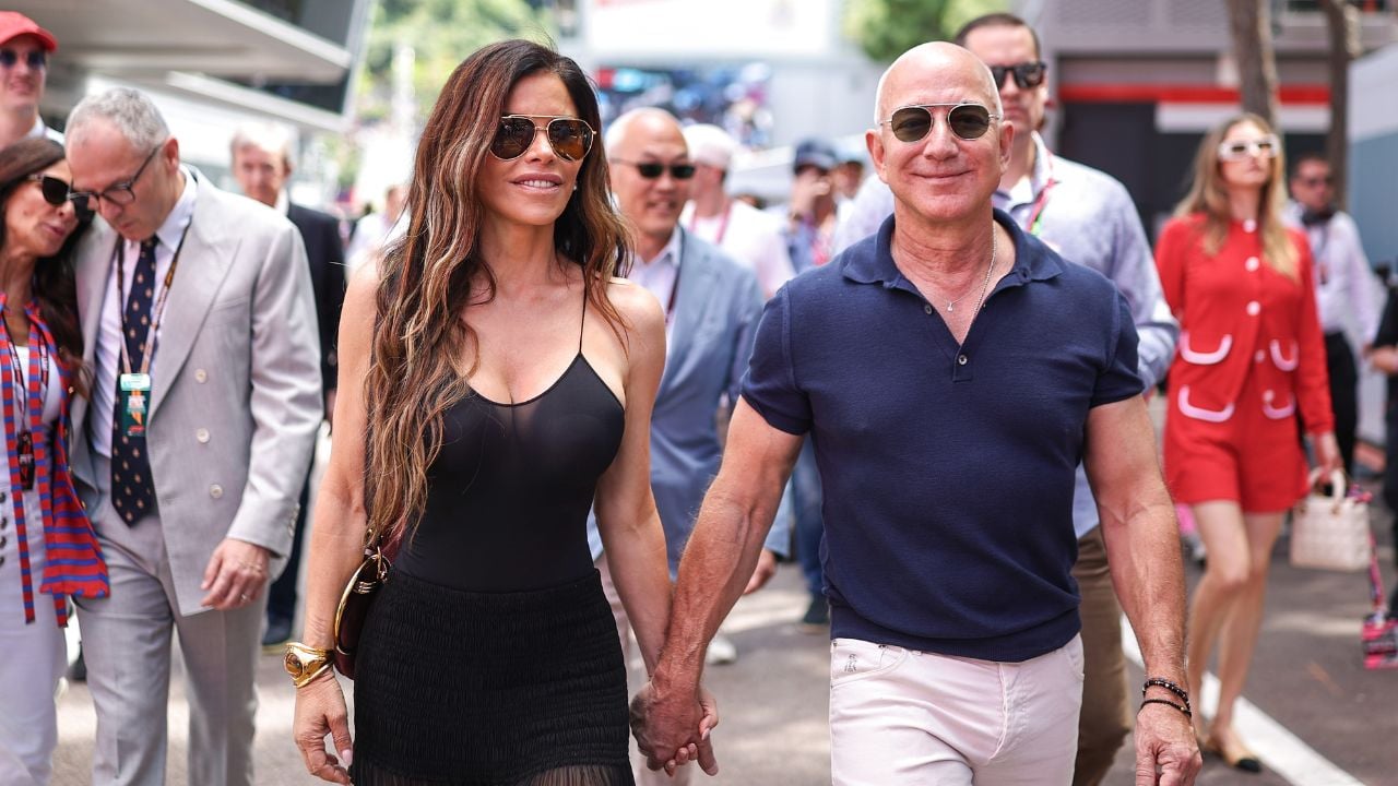 Jeff Bezos walks with Lauren Sanchez