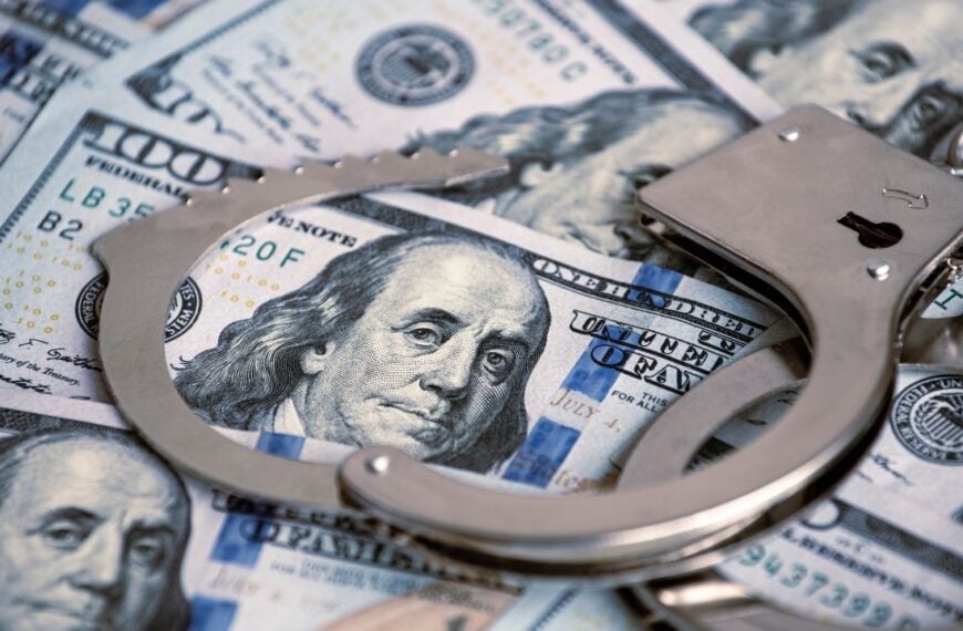 American dollars and handcuffs