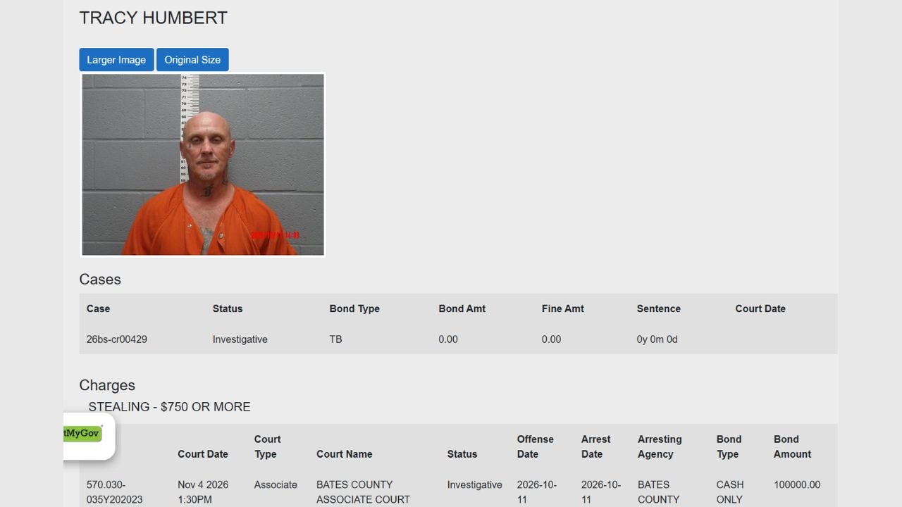 Bates County jail booking record showing Tracy Humbert's photograph, stealing allegation and $100,000 cash-only bond.