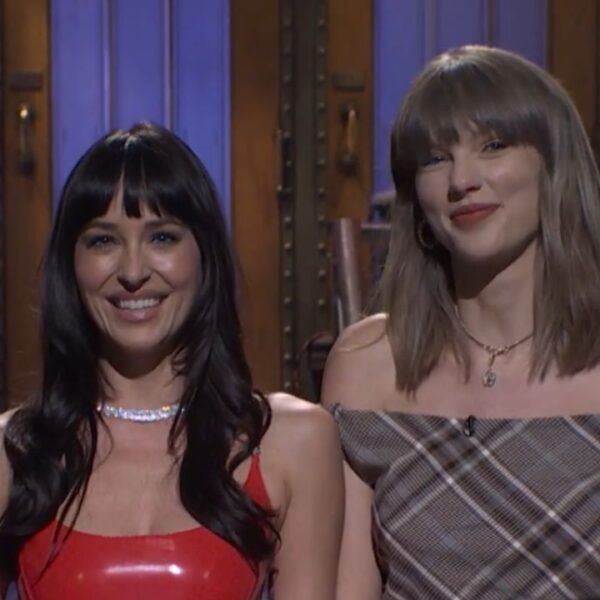 Dakota Johnson and Taylor Swift on stage during the Saturday Night Live monologue. 4 Taylor Swift and Dakota Johnson